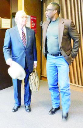 DeGuerin  (left) stands with Walker in the Jefferson County Courthouse.
