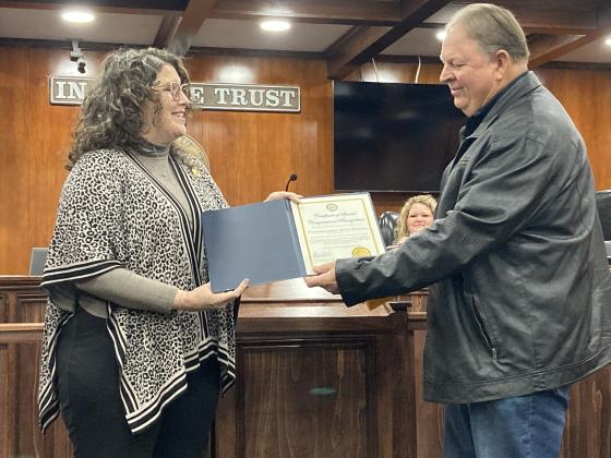 Hardin County Commissioner Alvin Roberts is presented a certificate for his years of service by Laney Brown, a representative from U.S. Rep. Brian Babin’s office. Photo By Dannie Oliveaux