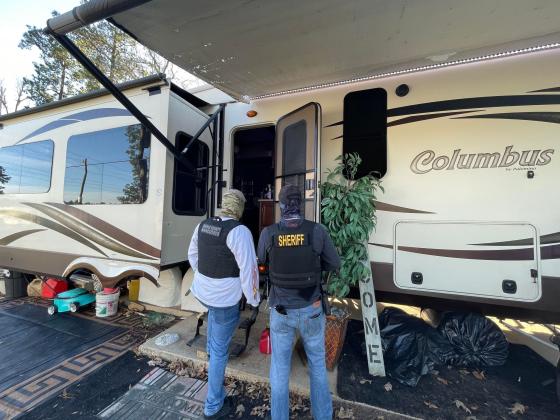 Fifth-wheeler where warrant was issued and suspects arrested.