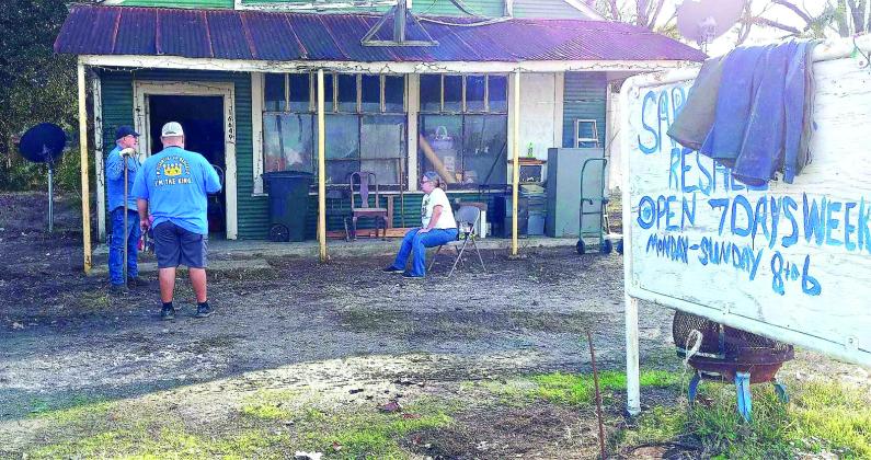 A group of nine volunteers converged on the Saratoga Resale shop with the goal of removing the trash and debris from in front and around the building Jan. 4. 