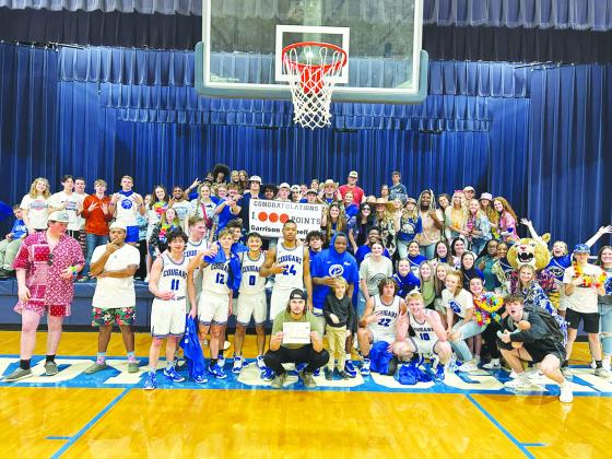 Buna celebrates Garrison Connell scoring 1,000 career points.