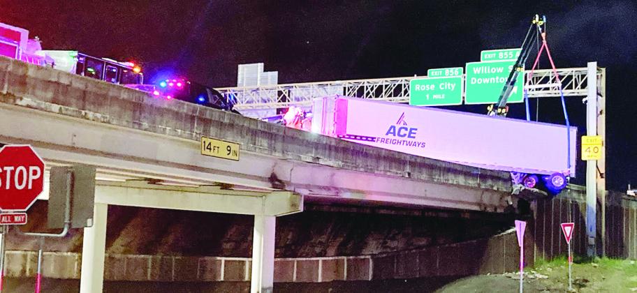 It took crews roughly six hours to remove the 18-wheeler, which hit and damaged the concrete barrier near the downtown exit. (Photo by Dannie Oliveaux)