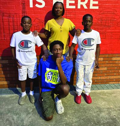 Habitat future homebuyer Adasha Palmer and sons