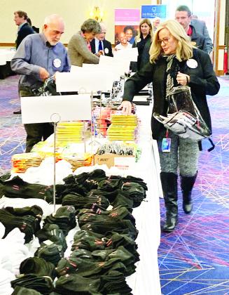 Volunteers gathered and assembled clear backpacks full of supplies for Beaumont ISD students.