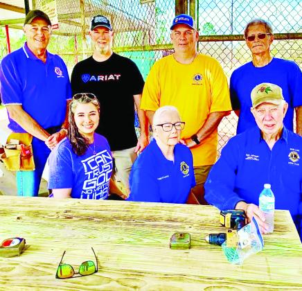 Sour Lake Lions members used teamwork to successfully construct four picnic tables at the Twin County Youth Baseball and Softball League’s Park. 