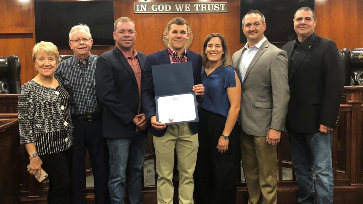 Sam Dickerson, center, along with Sharon and Larry Dickerson, Jason and Cheri Dickerson, State Rep. Ernest Bailes and Hardin County Judge Wayne McDaniel