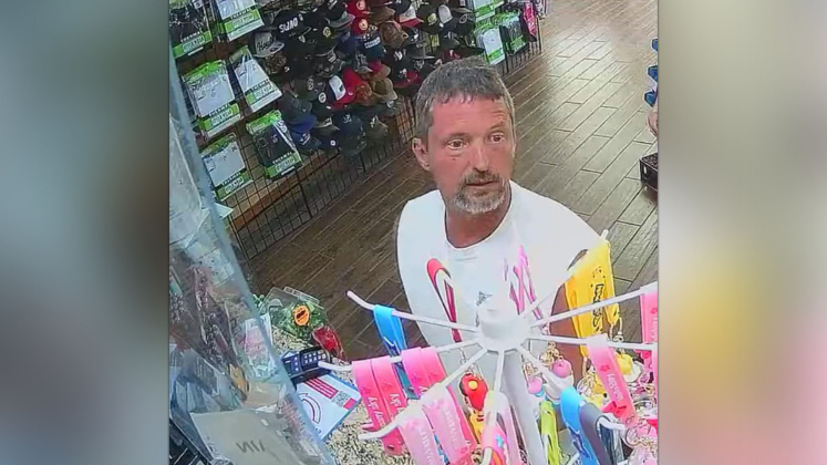 Suspect passing counterfeit money