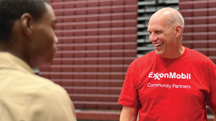 ExxonMobil employee Aaron Moore speaks with students at running start at Beaumont United High School.