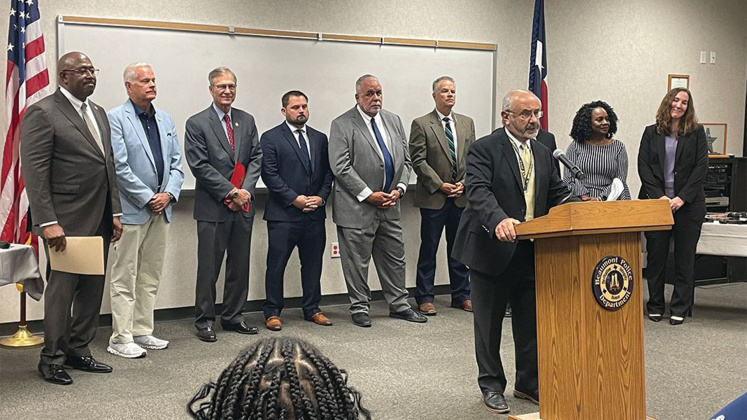 Standing behind Police Chief Jimmy Singletary are (left to right) City Manager Kenneth Williams, Mayor Roy West, Congressman Brian Babin, Assistant U.S. Attorney Russell James, Jefferson County Criminal District Attorney Keith Giblin, former U.S. Attorney Brit Featherston, Assistant D.A. Pat Knauth (unseen), Sheriff Zena Stephens and ATF Resident Agent in Charge Jennifer Owens.