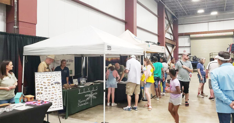 Fairgoers converge on the exhibits during the Champions for Nature event.