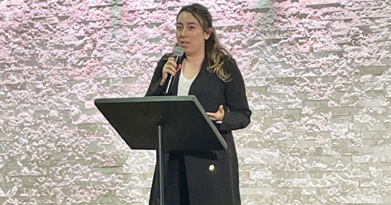 Harvest House Education Coordinator Brittany DeLaGarza speaks during a presentation at Abundant Life