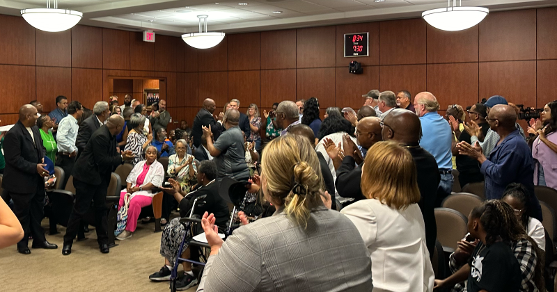 Attendees give a standing ovation to newly-confirmed BPD Police Chief Tim Ocnaschek.