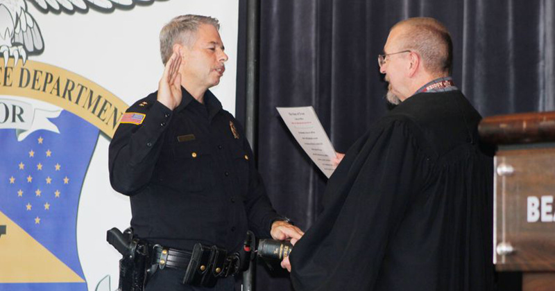 Judge Craig Lively (right) swears in Beaumont’s newest police chief.