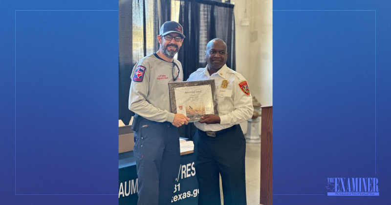 District Chief Josh Fowler is honored by Chief Earl White in celebration of retirement after 24 years of service to the department.