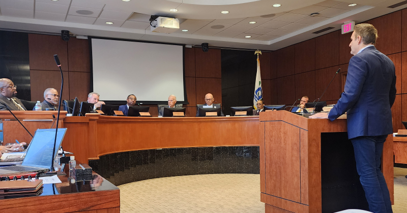 Flanagan speaks before city council March 18. (Photo by Barbara Davis)