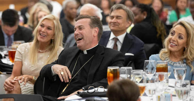 Guest speaker Bishop David Toups enjoys the celebration with Kelli and Qamar Arfeen, and Starla Faust.