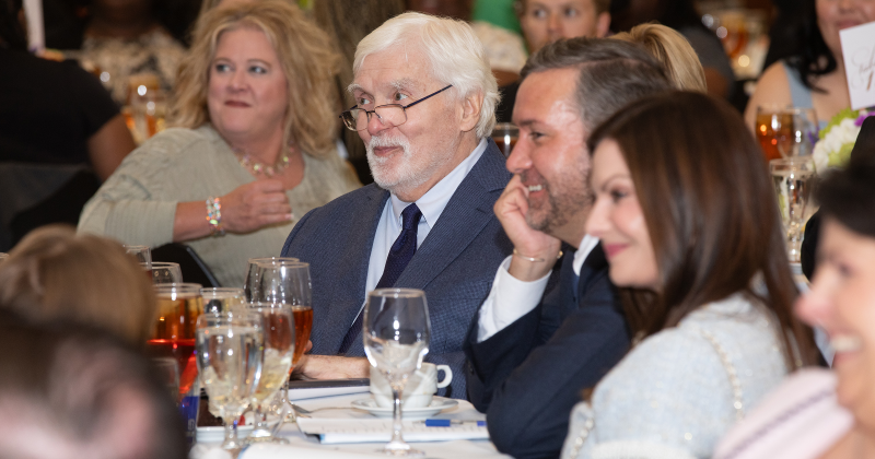 With pride and admiration, the Reaud family looks on as dedicated educators are recognized for their commitment to shaping young minds.