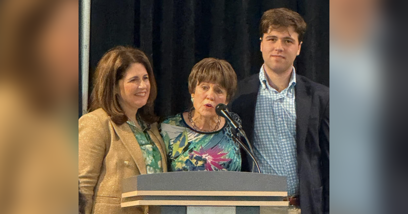 Keynote Speaker Lisa Helfman, Managing Director of Public Affairs Houston for H-E-B Grocery, joined by son Drew and MHA of SETX Luncheon Co-Chair Regina Rogers