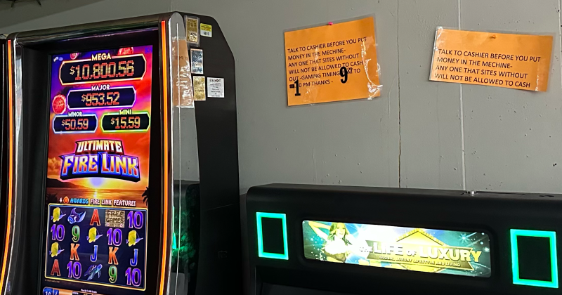 Signage posted within Pick N Shop — 870 S. Major Drive — indicating cash payout